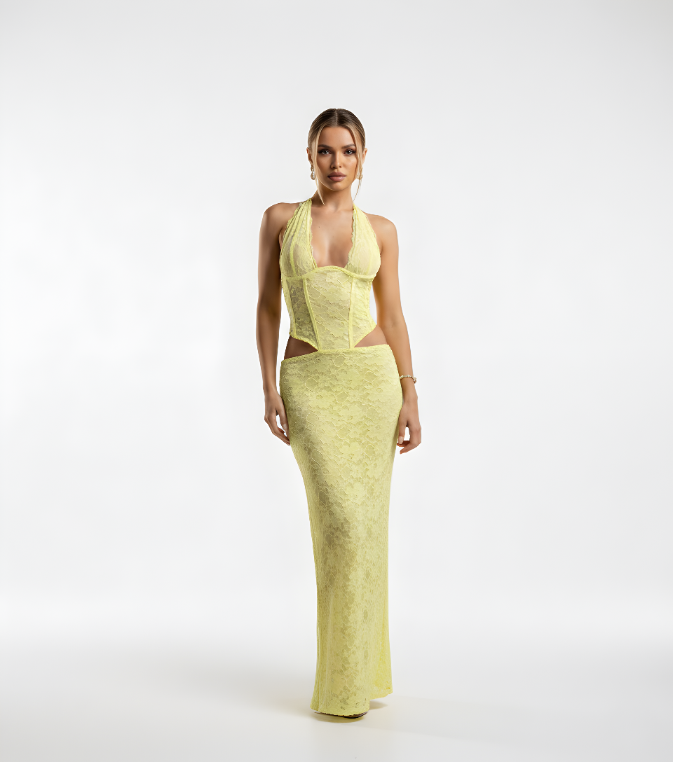 Woman wearing a yellow evening gown on a white background